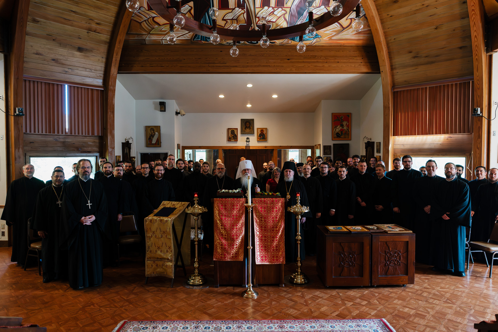 Members of the seminary community gathered in a chapel with Metropolitan Tikhon
