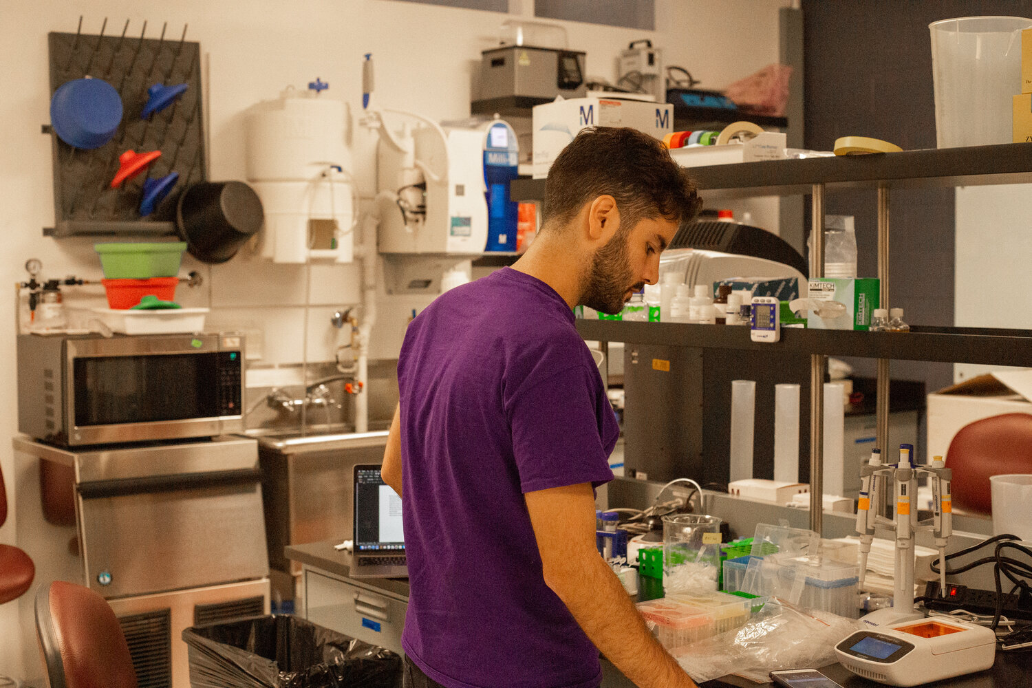 A scientist working at a bench in Octant's Emeryville laboratory