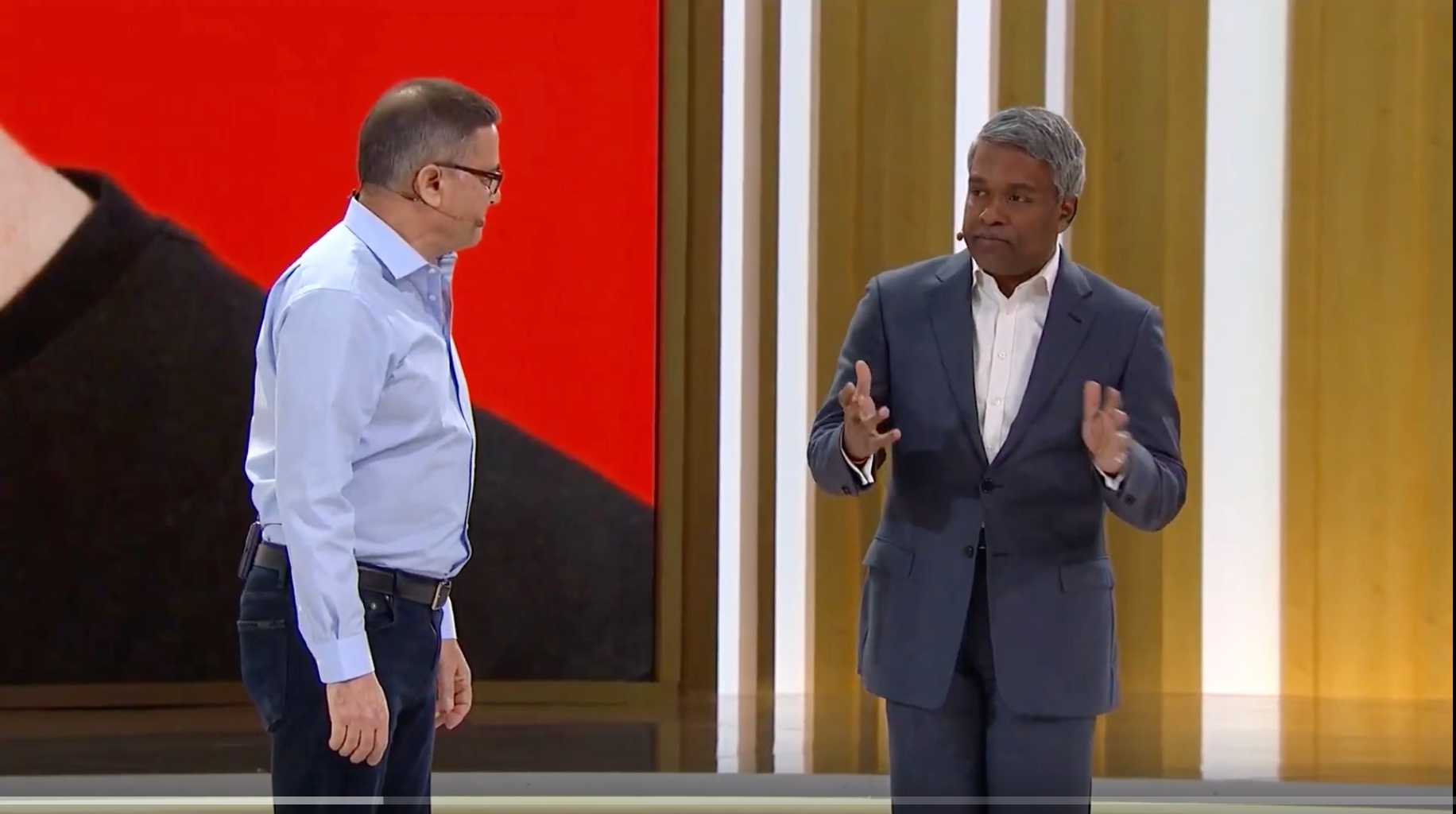 Ofer Bengal at left speaking onstage with Google Cloud CEO Thomas Kurian