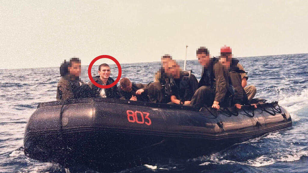 Archival photograph of Ofer Shacham, circled in red, aboard an inflatable boat during his Navy service