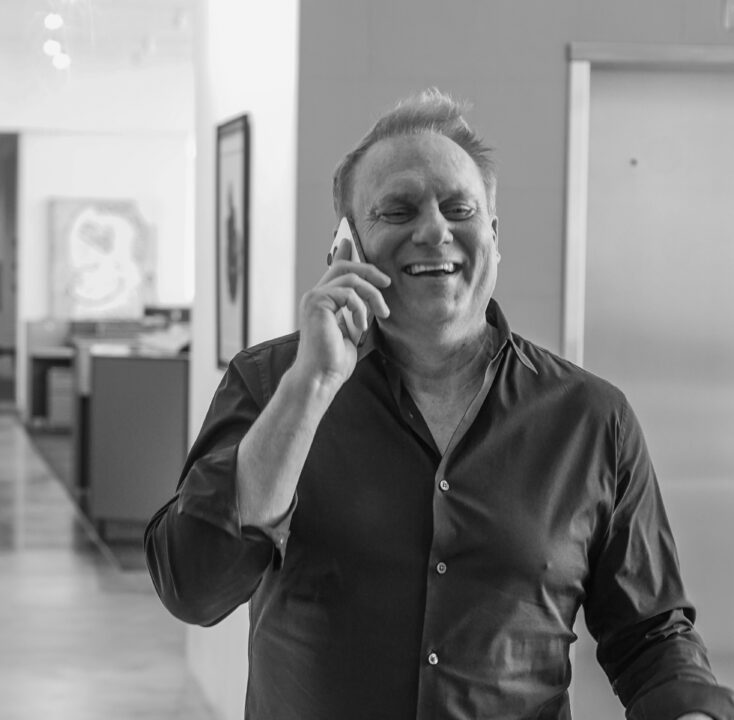 Off Madison Ave founder Roger Hurni speaking on a phone
