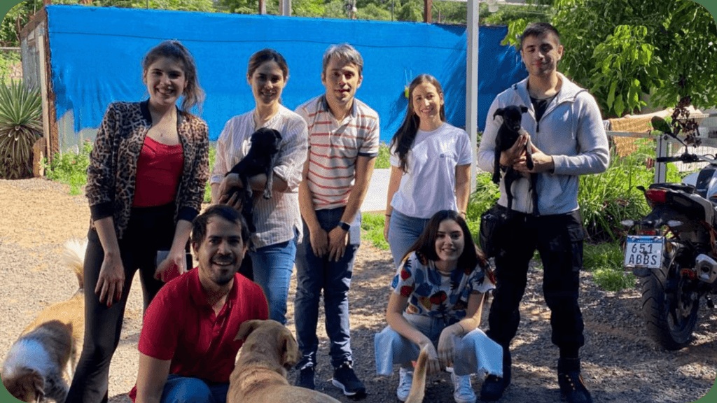 Volunteers pictured with dogs in a photograph published by Oktana