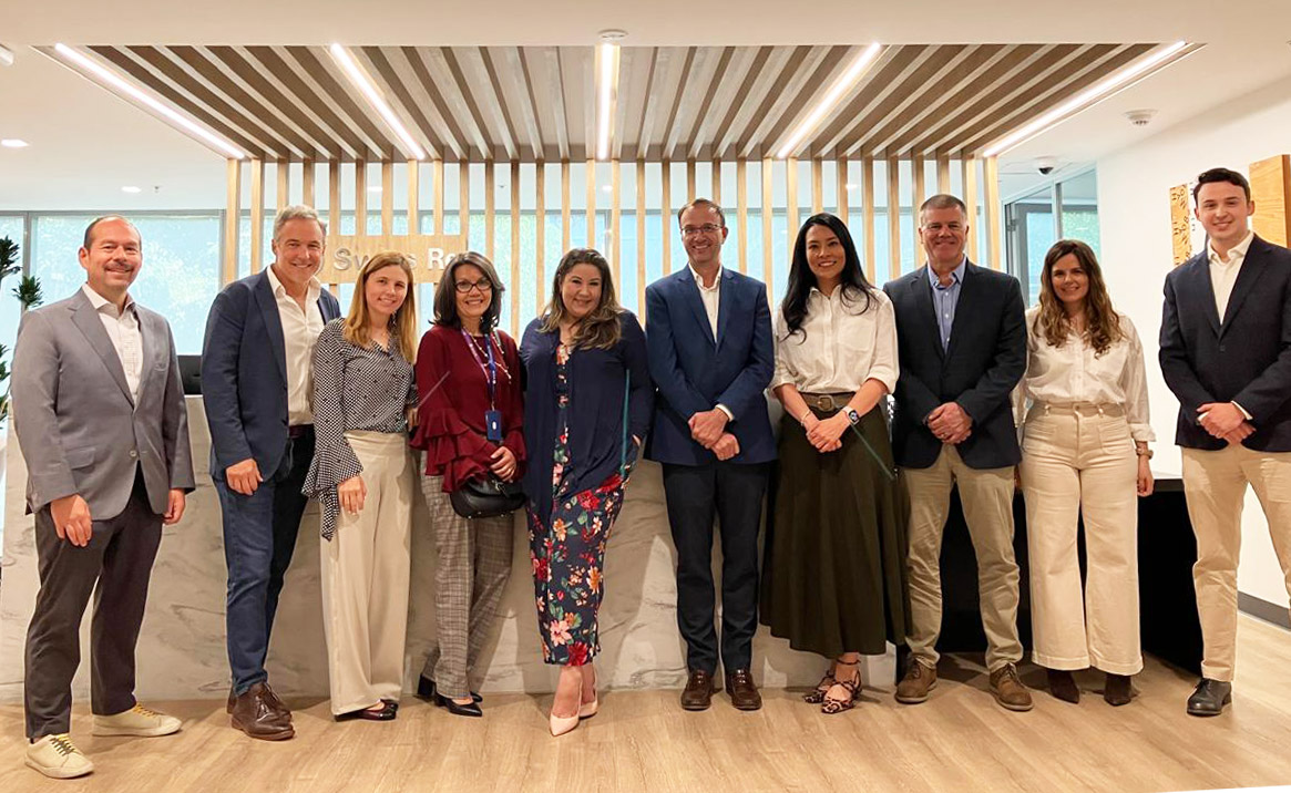 Olé Life and Swiss Re representatives gathered for the reinsurance partnership