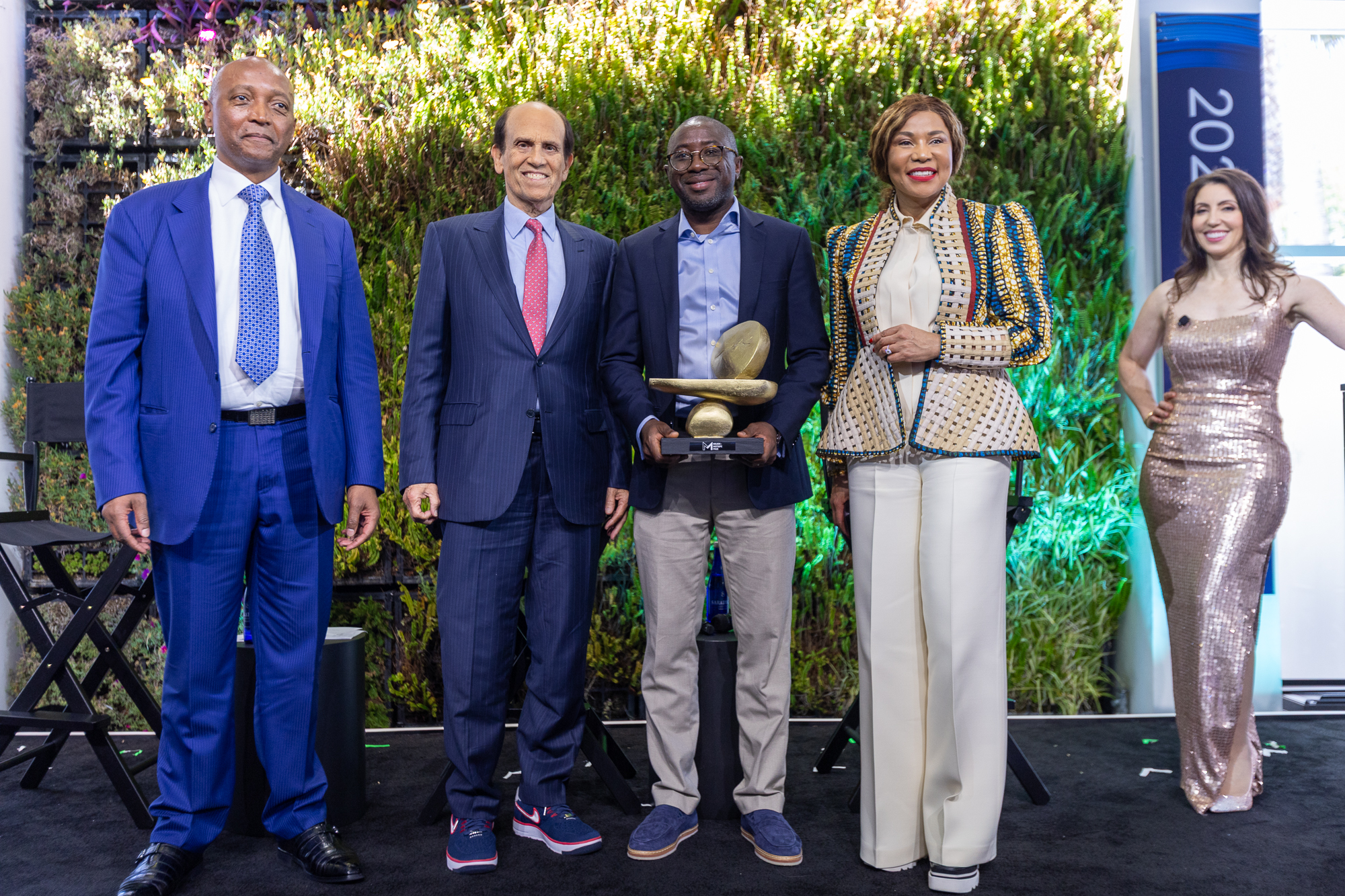 Ola Oyetayo, centre, holding Verto’s award with Patrice Motsepe, Michael Milken, Precious Moloi-Motsepe and Emily Musil at the 2025 Milken Institute Global Conference.