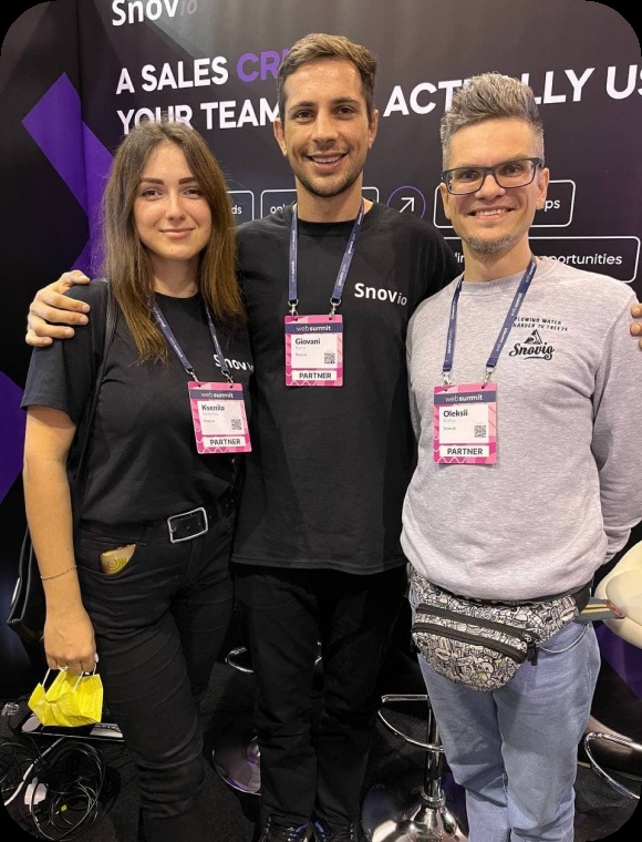 Oleksii Kratko, at right, with two Snov.io colleagues at a Web Summit booth