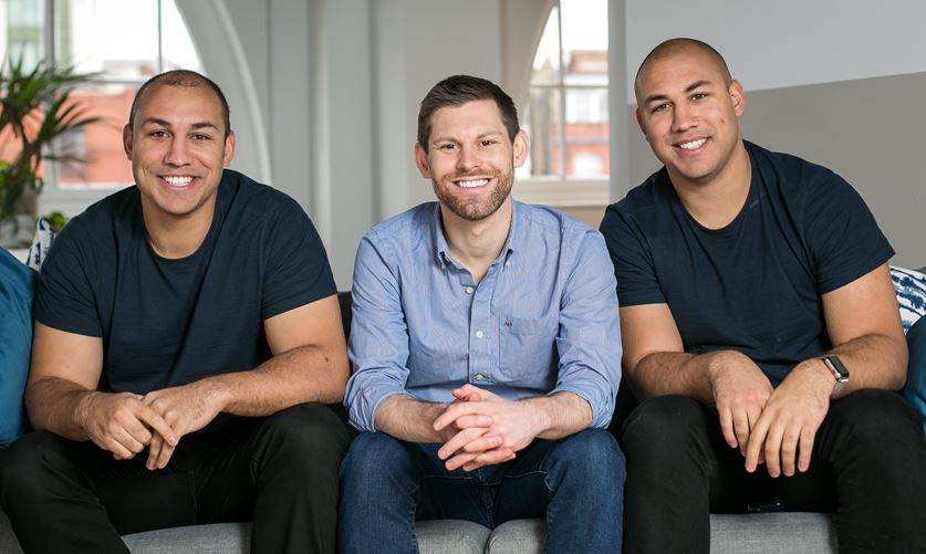 The three Marshmallow co-founders seated together in an office