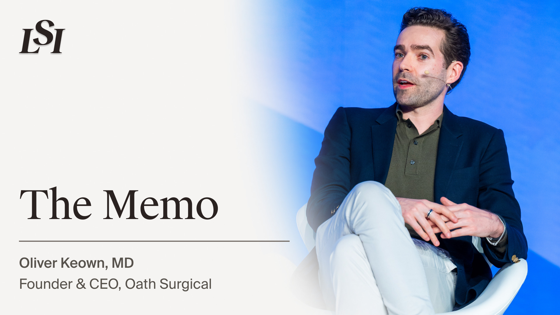Oliver Keown seated onstage during a Life Science Intelligence talk titled The Memo