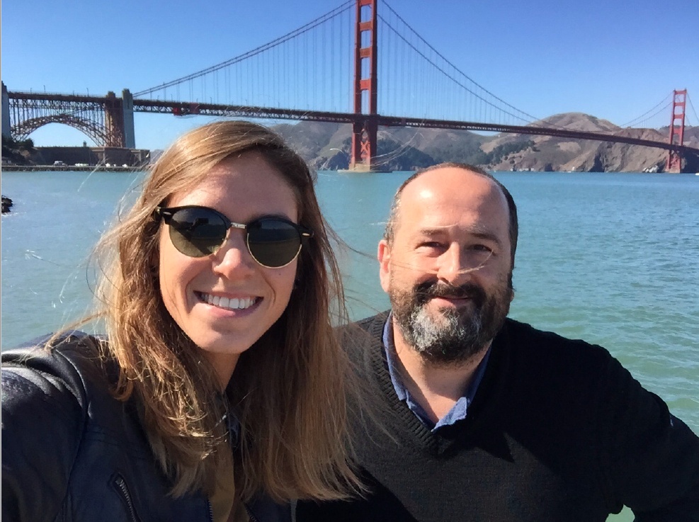 Laurie Galazzo and Olivier Verdin beside San Francisco Bay, with the Golden Gate Bridge behind them