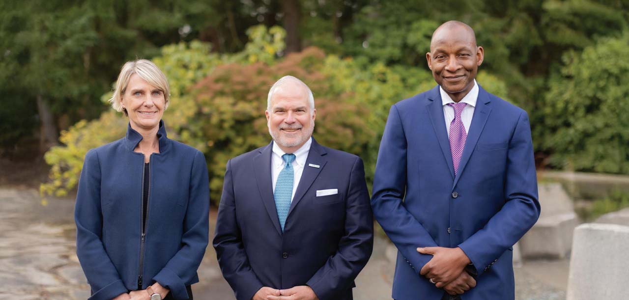 Tami Newcombe, James Lico and Olumide Soroye standing together outdoors