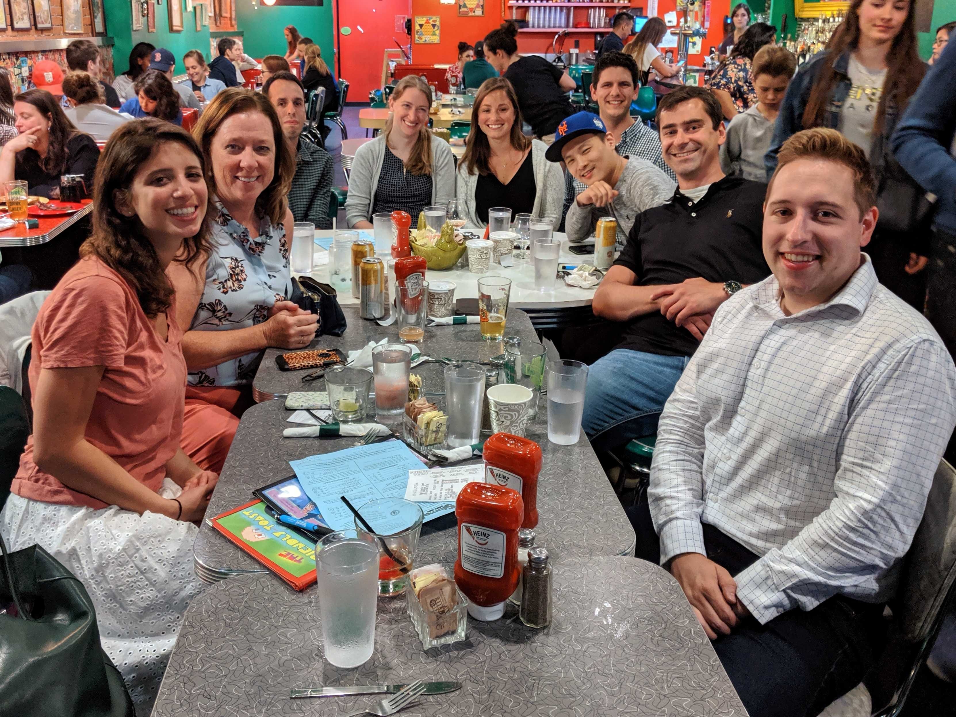 OM1 colleagues together at a team trivia event