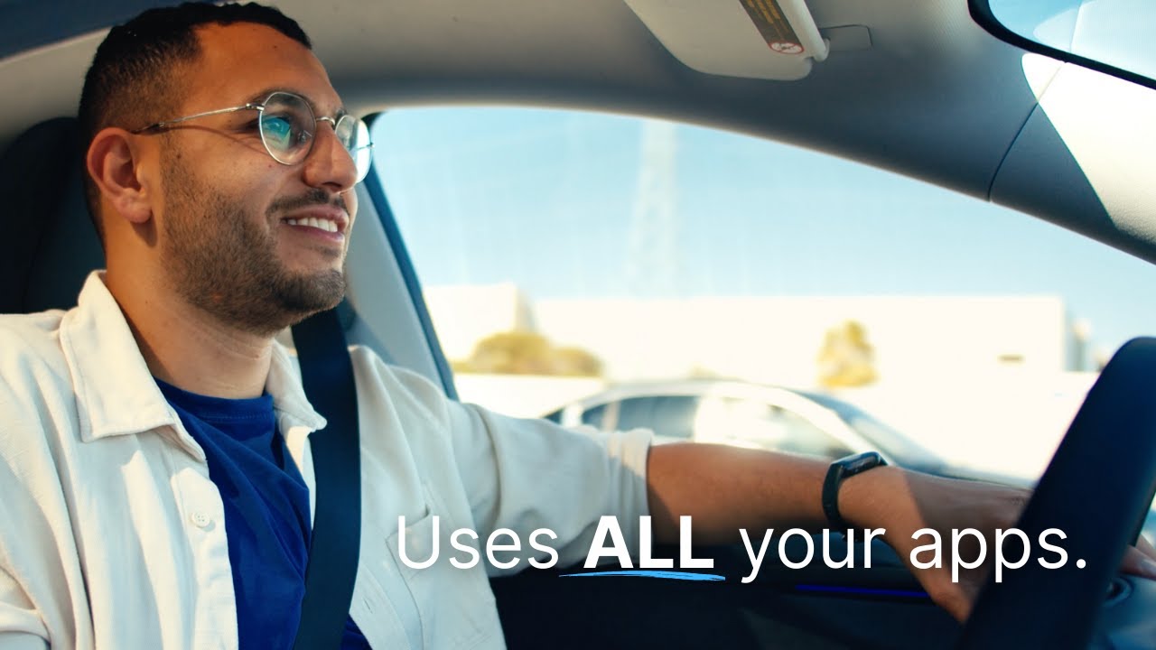 Omar Abdelaziz demonstrating Blue while seated in a car