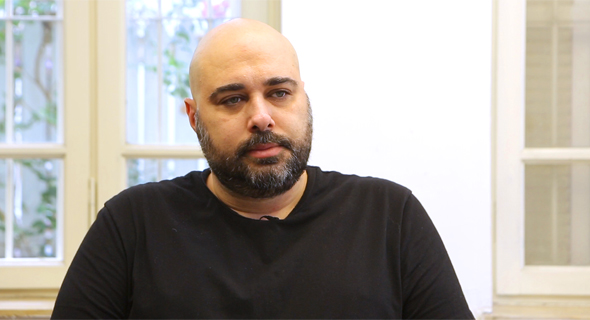 Omri Lavie seated for an interview, wearing a black shirt
