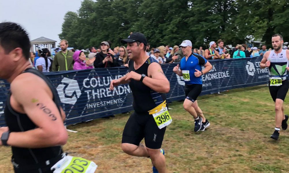 Omri Shor running among competitors at an outdoor race