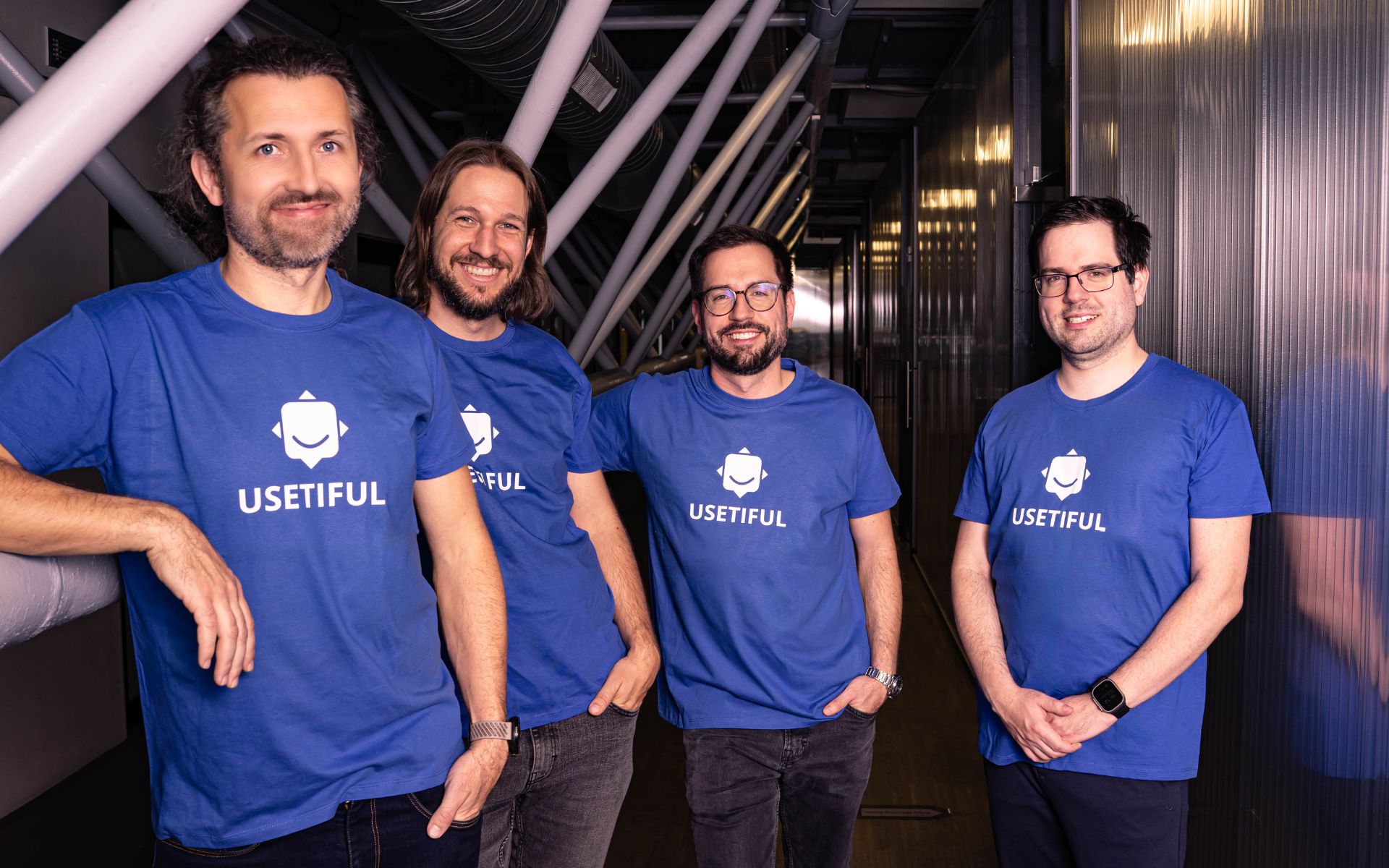 Usetiful cofounders Michal Jurzykowski, Ondrej Dobias, Jan Alexandr Janíček and Tomáš Maxmilián Janíček in blue company shirts
