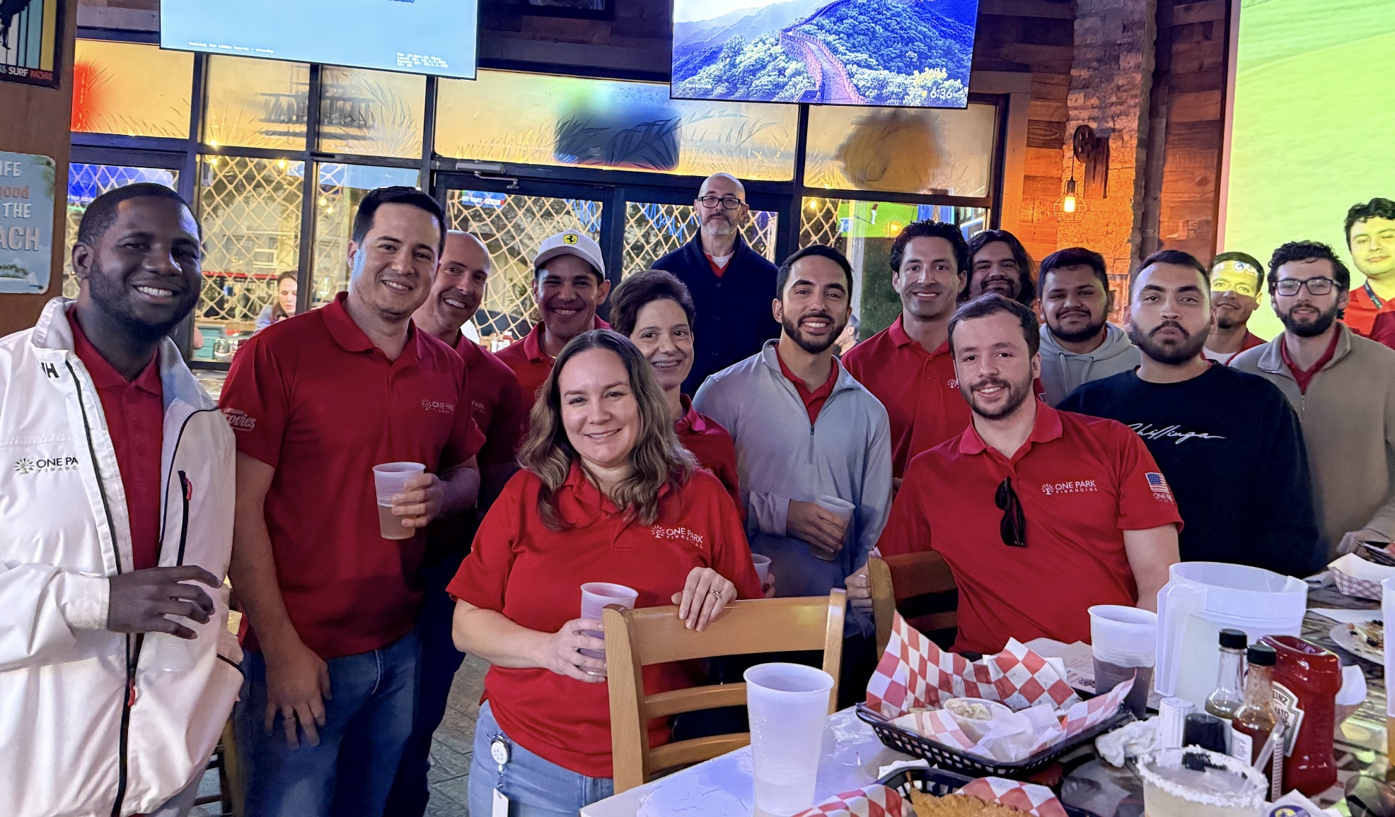 One Park Financial colleagues gathered around a restaurant table