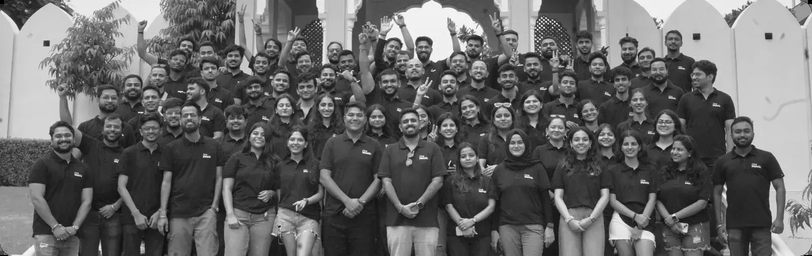 OneMetric team gathered outdoors for a group photograph