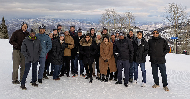 Onix team members gathered on a snowy mountain