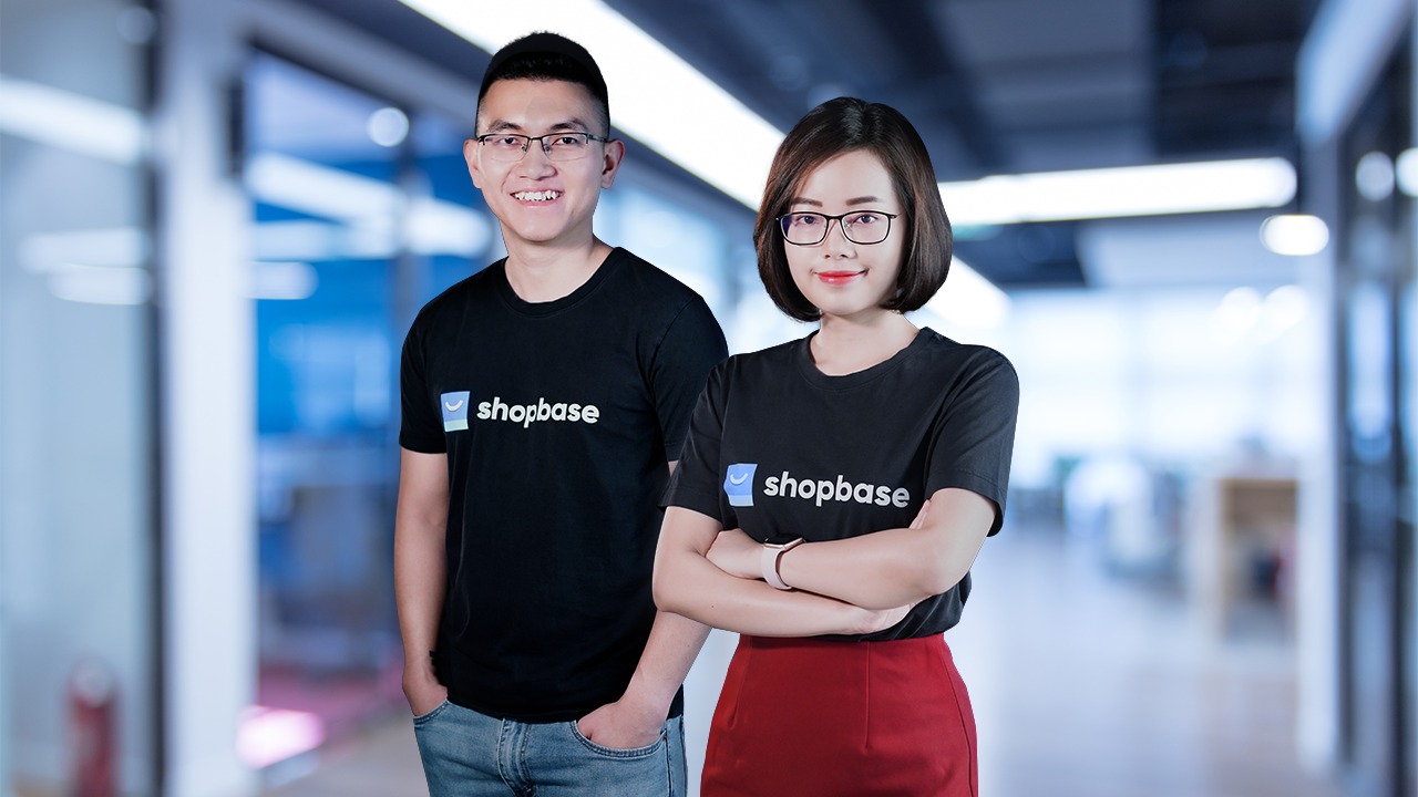 OpenCommerce Group co-founders Quan Truong and Phuong Anh Ha wearing ShopBase shirts