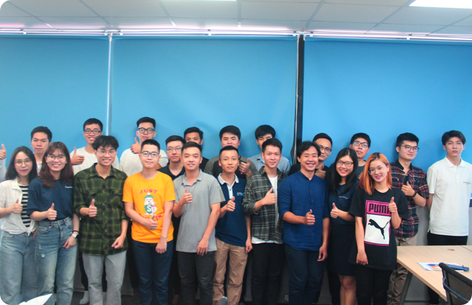 OpenCommerce Group team members standing together in an office