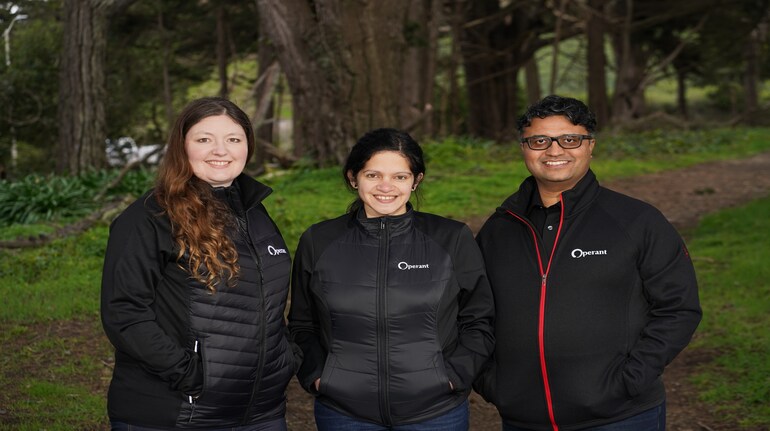 Operant AI co-founders Ashley Roof, Priyanka Tembey, and Vrajesh Bhavsar standing together outdoors