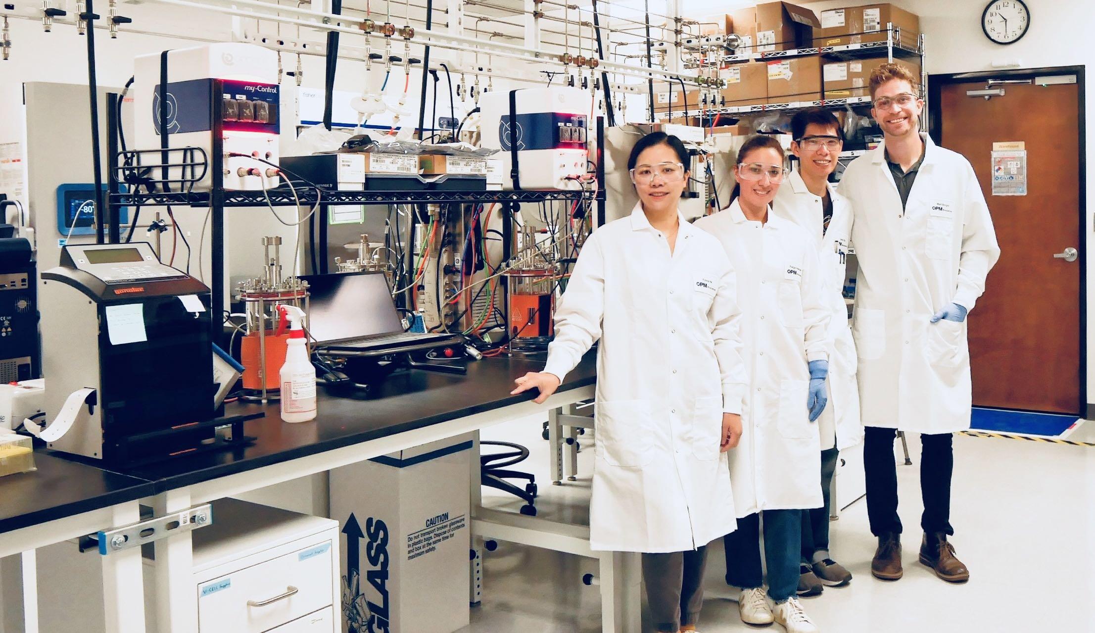 OPM scientists working together in a laboratory