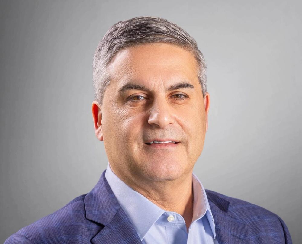Optro CEO Raul Villar Jr. in an official company portrait