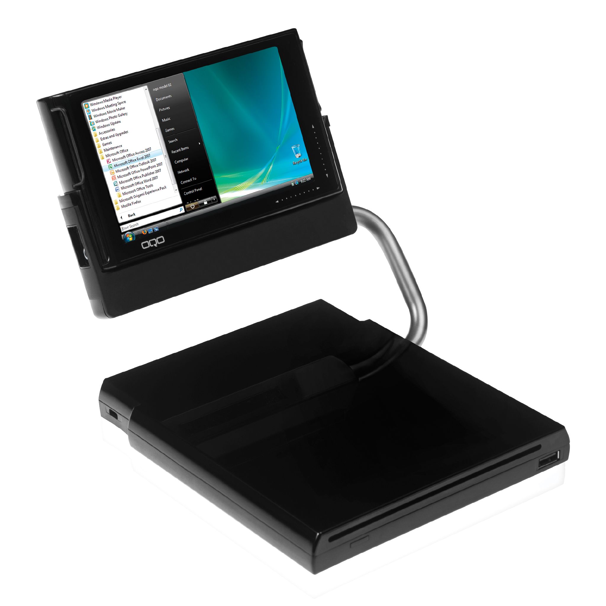 OQO Model 02 resting on its docking station with the screen closed over the keyboard