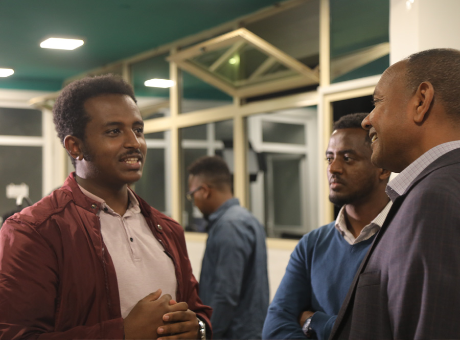 Participants talking together at an Orbit community event