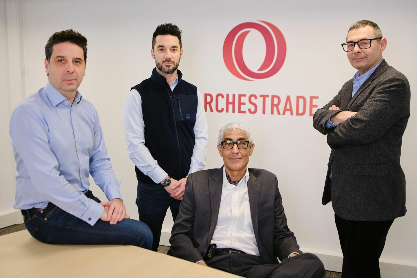 Orchestrade executives Jonathan Gane, David Coe, Hakim Erhili and Paul Bardavid together in an office