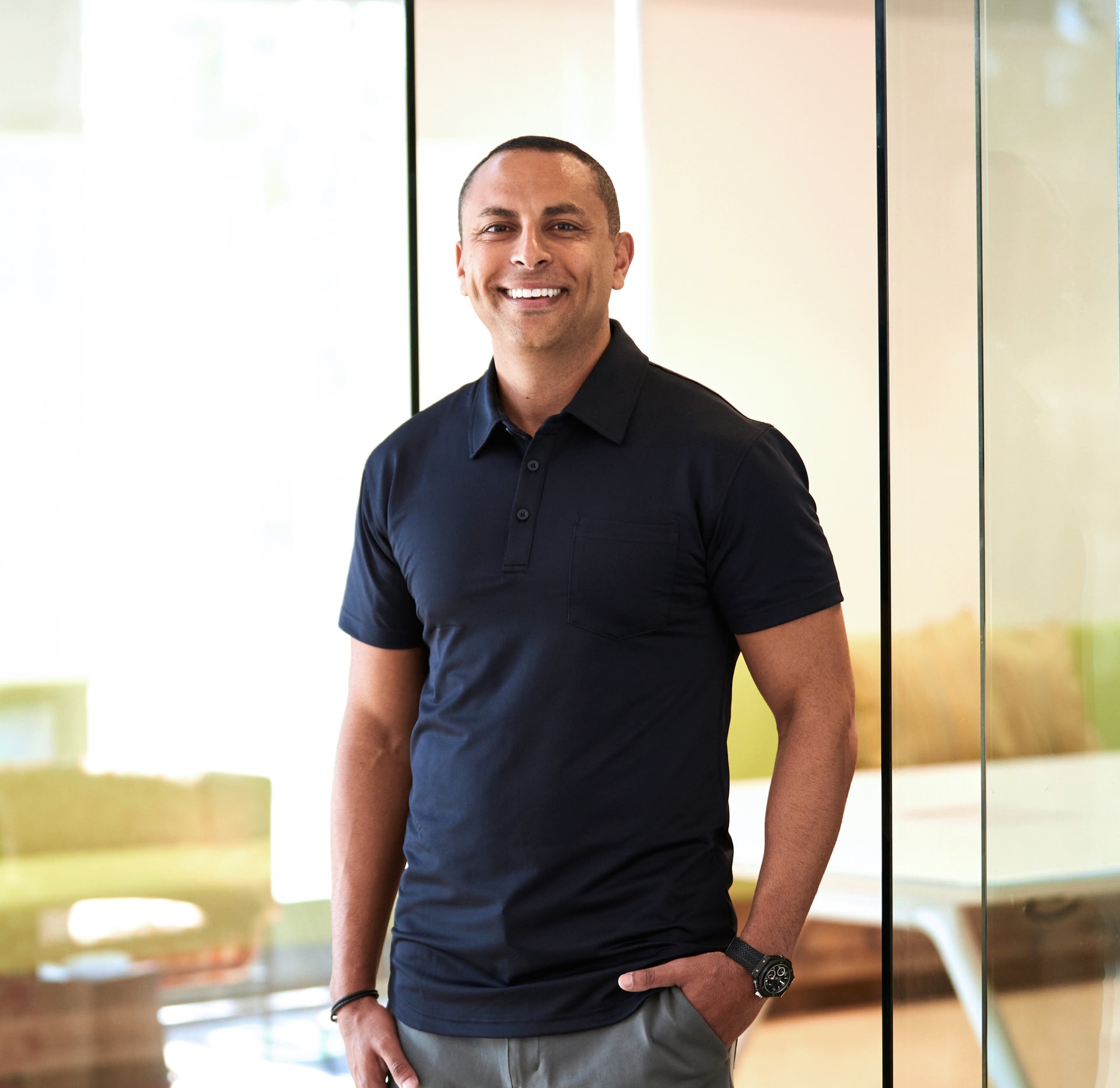 Orgain founder Andrew Abraham standing in a bright modern office