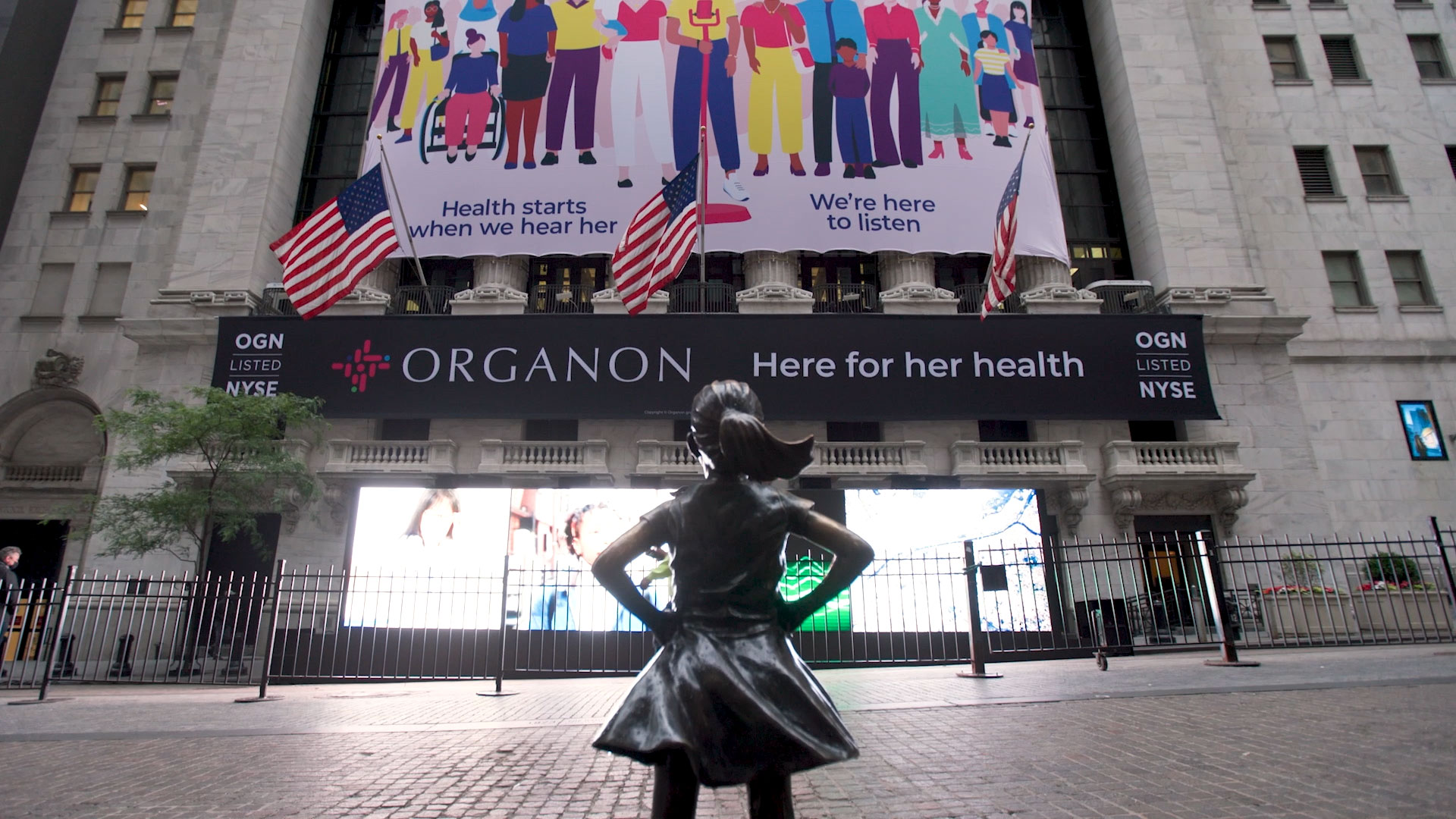 Fearless Girl faces Organon’s 2021 launch signage at the New York Stock Exchange