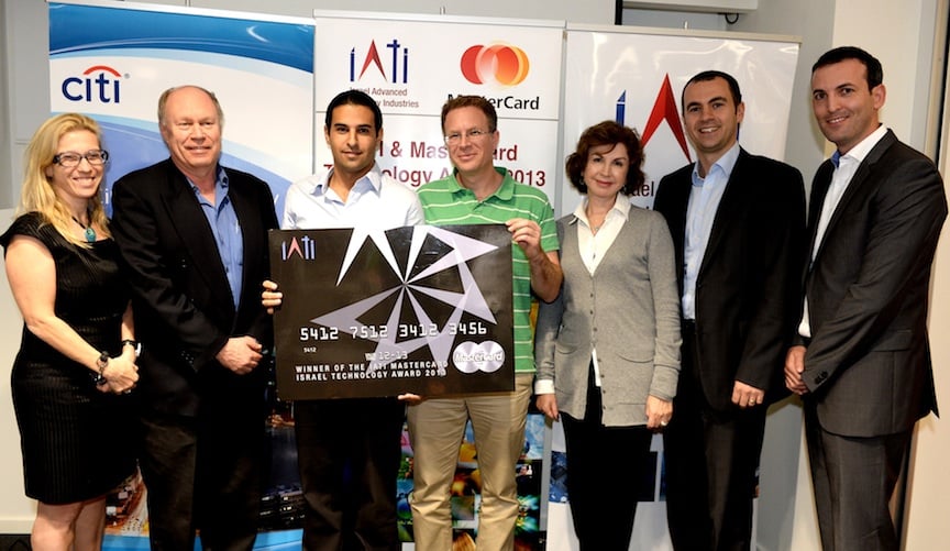 Ori Faran, third from left, and fellow co-founder Doron Rotsztein accepting the 2013 MasterCard Israel Technology Award with the organizers