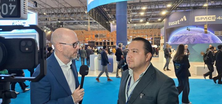 Santiago Rivera, right, speaking with a TeleSemana interviewer at Mobile World Congress 2026