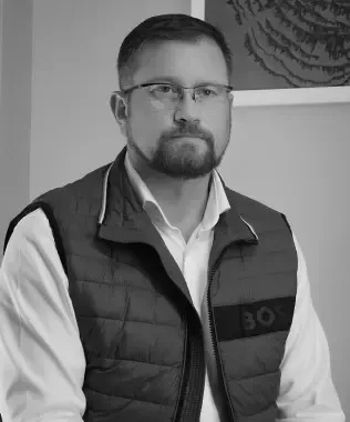Black-and-white portrait of OSF Digital co-founder Gerry Szatvanyi