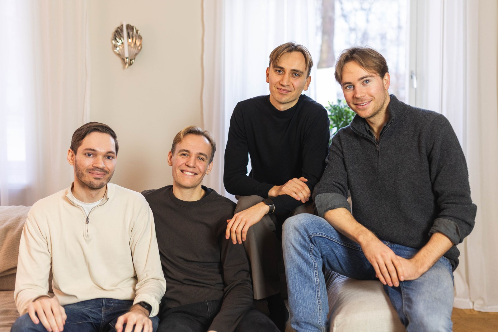 The four Stilta founders seated together in an office