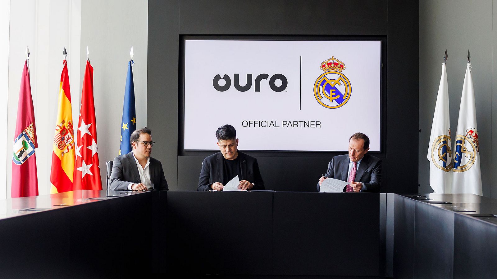 Representatives of Ouro and Real Madrid at the April 2024 partnership signing