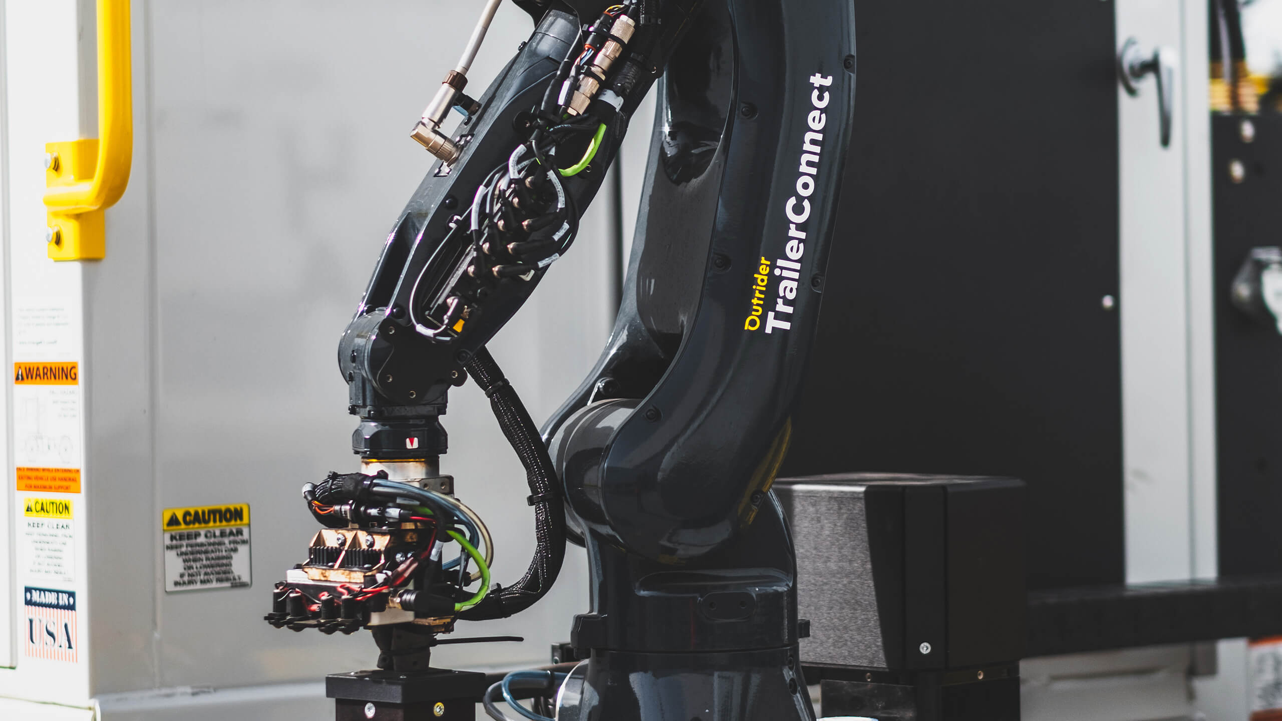 Close view of Outrider's TrailerConnect robotic arm