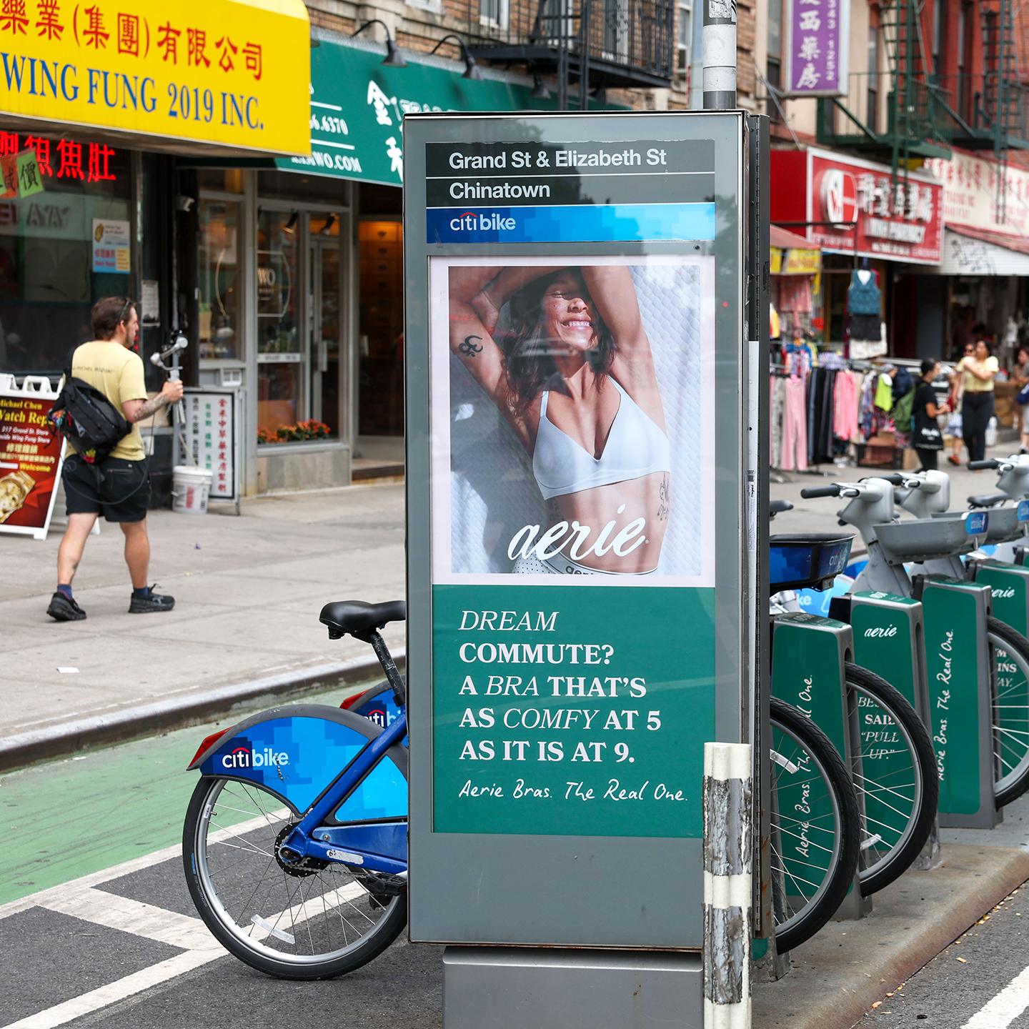 Aerie advertisement beside Citi Bikes at Grand Street and Elizabeth Street in New York