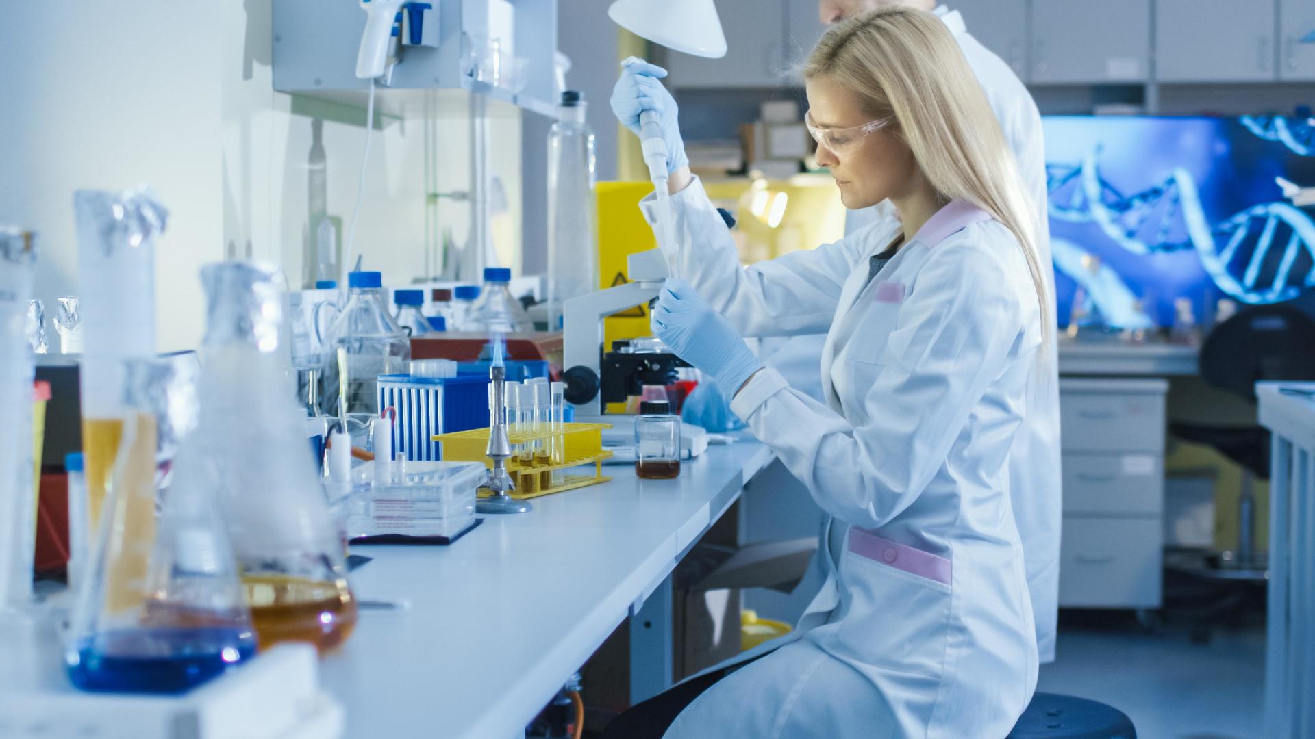 Laboratory scientist working beside analytical instruments