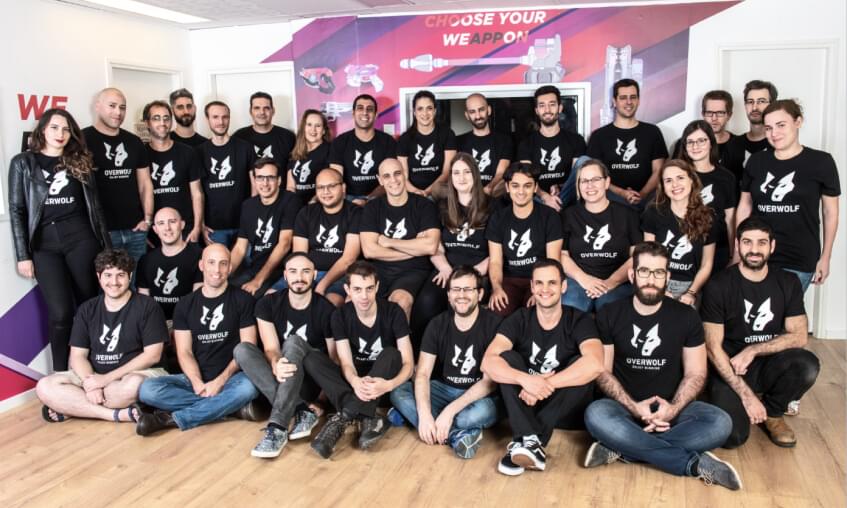Overwolf team members posing together in their office