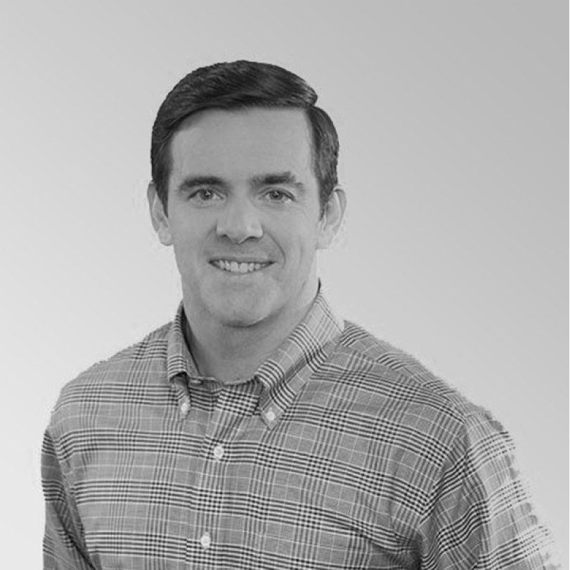Archival American Tire Distributors press photograph of Owen Schiano in a checked shirt