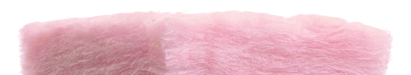 Close view of the fine pink fibers in fiberglass insulation