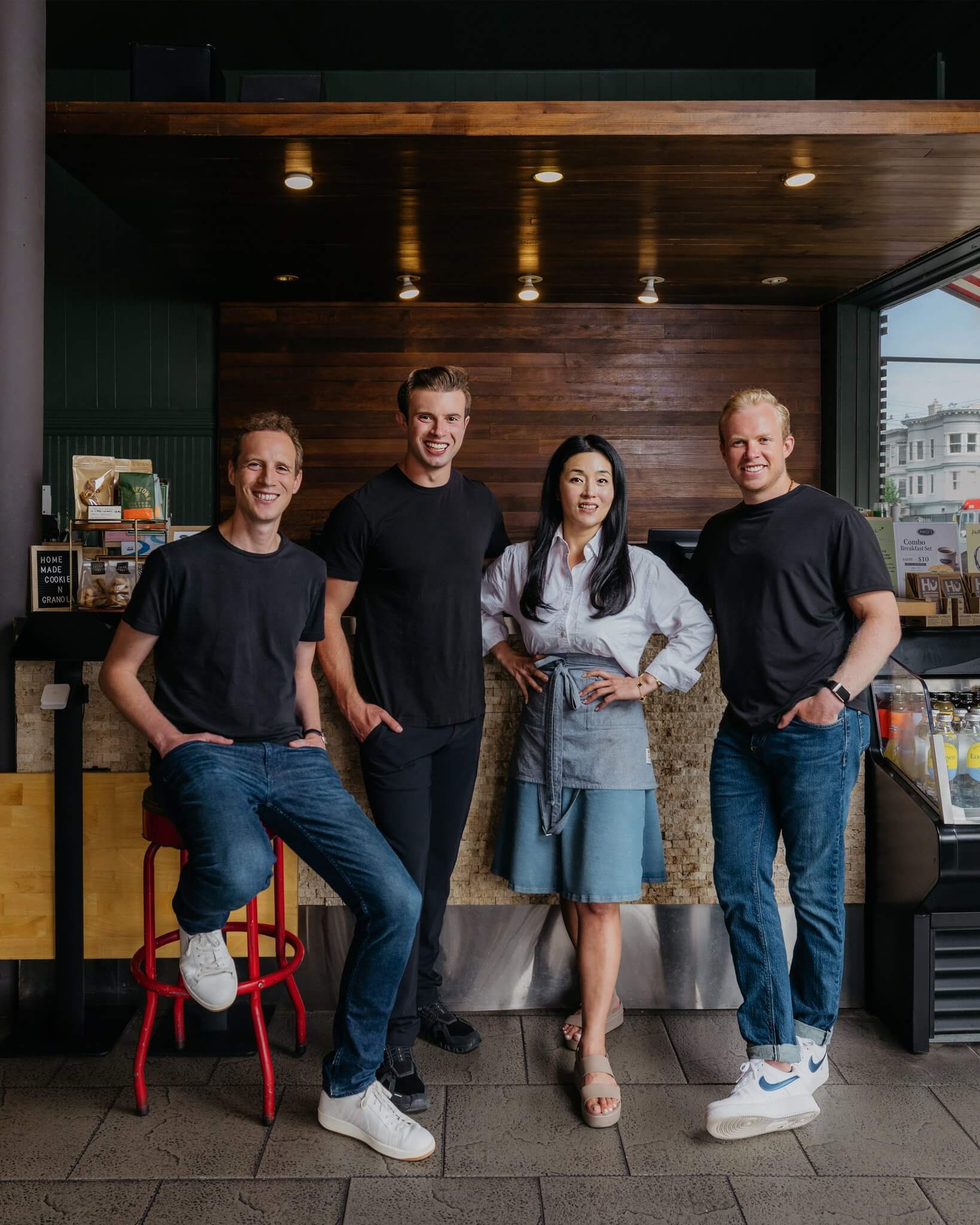 Members of the Owner team standing with a restaurant operator inside a restaurant