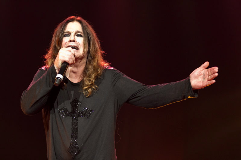 Ozzy Osbourne performing under red stage lights at Wacken Open Air in 2011