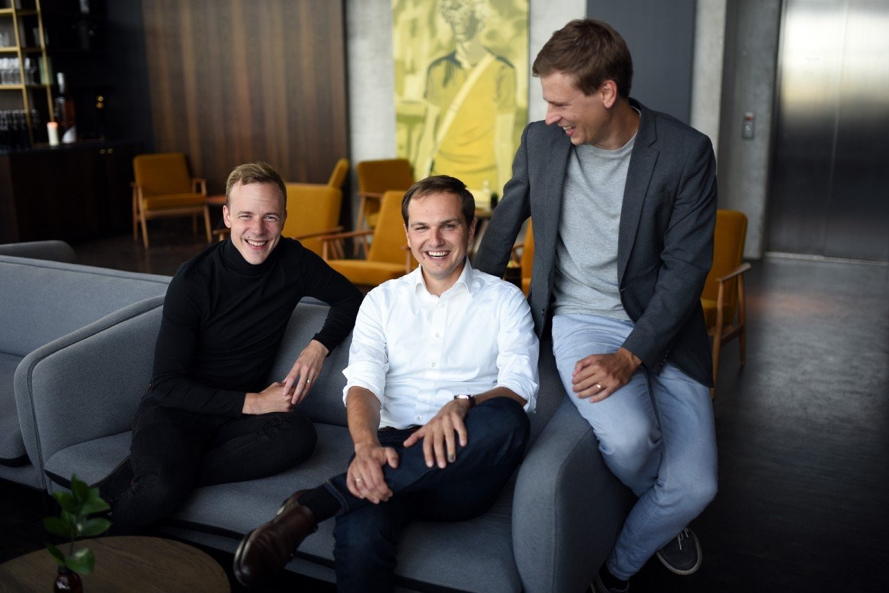 Pactum co-founders Kristjan Korjus, Martin Rand and Kaspar Korjus seated together in an office