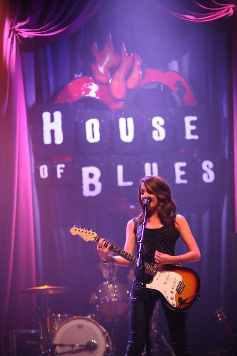 Paige Velasquez Budde playing electric guitar and singing at House of Blues