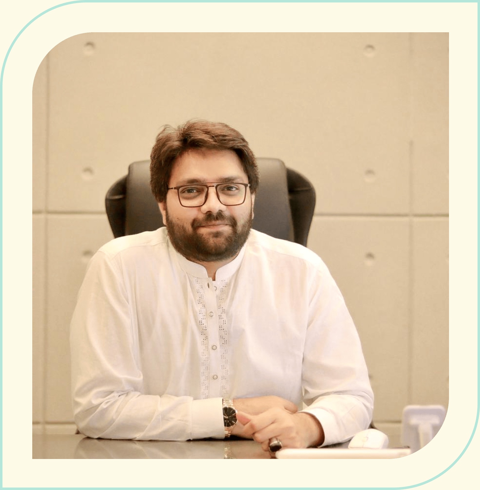 Paklogics founder and CEO Ali Altaf seated at a desk