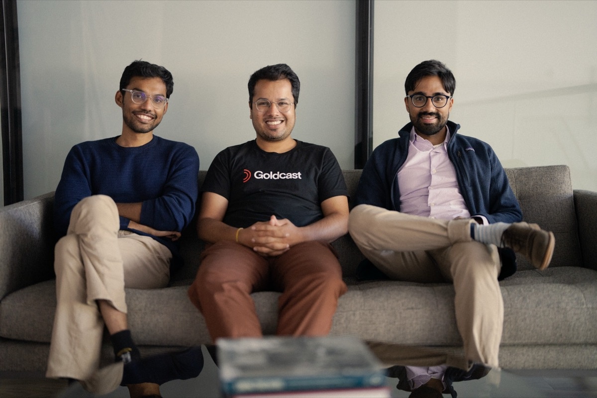 Goldcast’s three co-founders seated together on a sofa