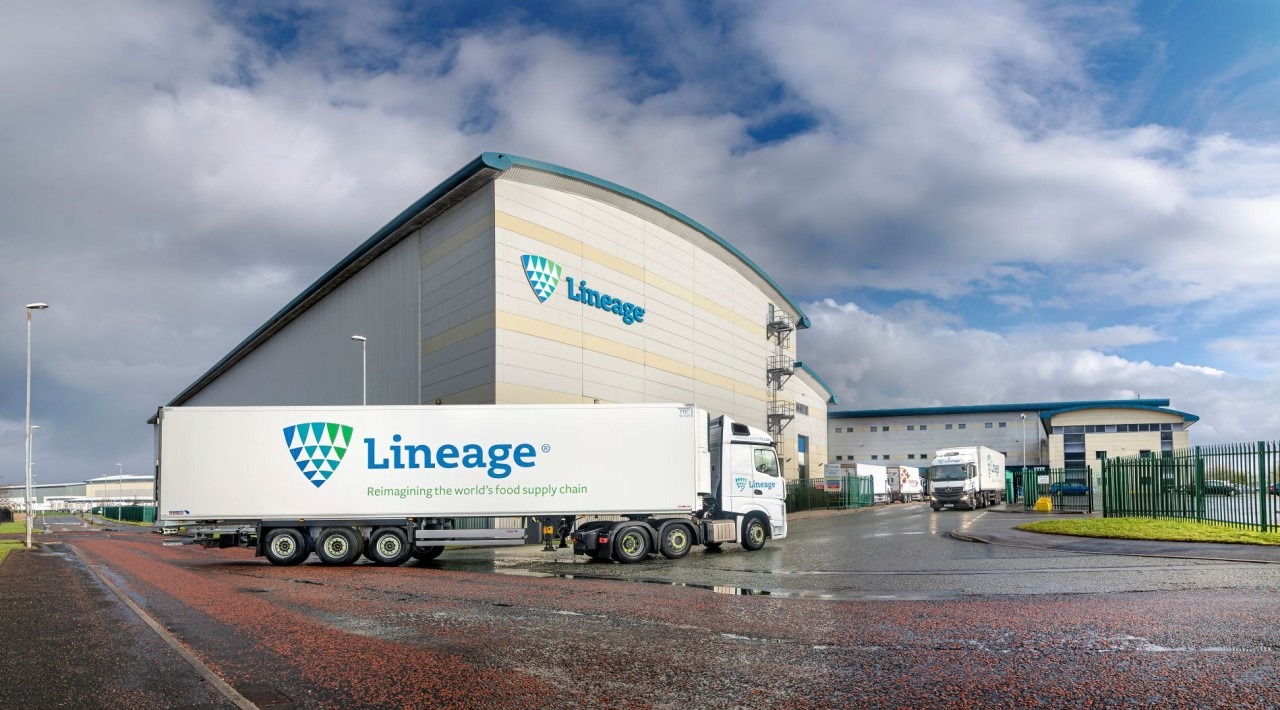 Lineage refrigerated truck outside a branded logistics facility