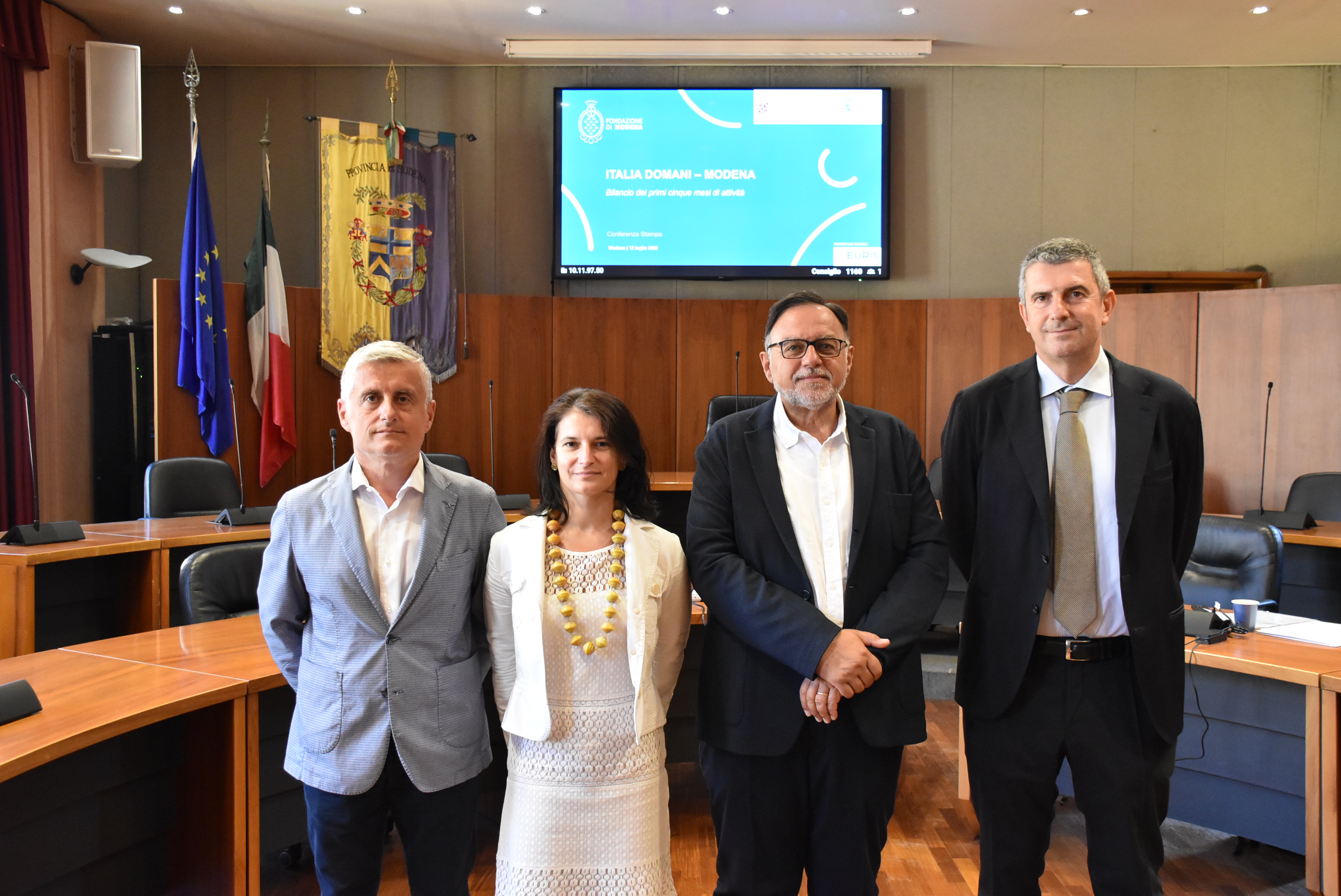 Four institutional representatives at the Italia Domani - Modena presentation; Paolo Cavicchioli stands at the far right.